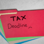 Tax,Deadline,With,Sad,Face,Written,On,Red,File,Folder